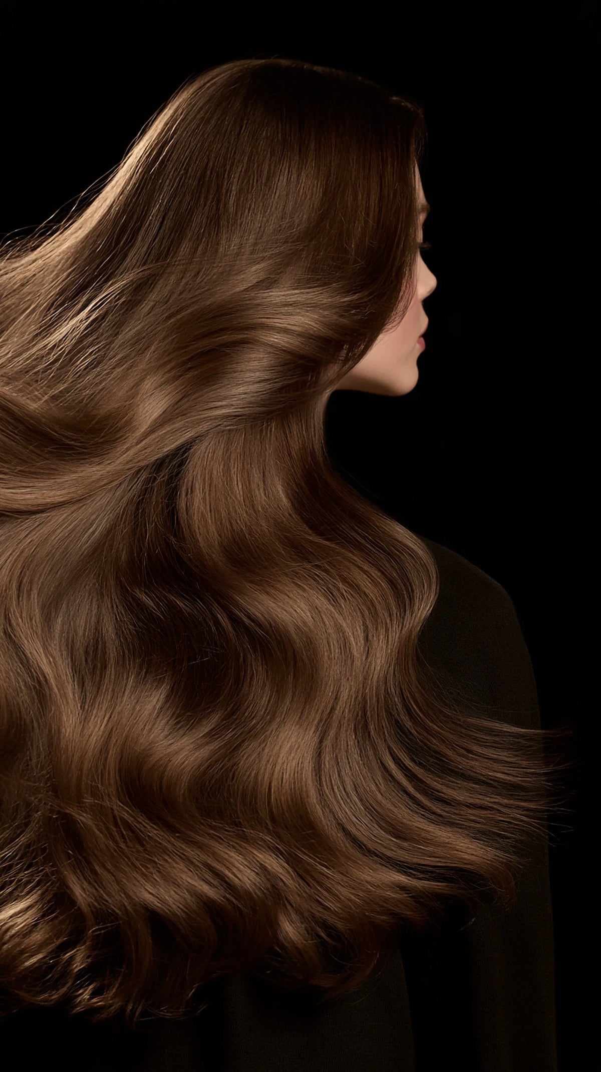 Editorial portrait from behind, long dark waves