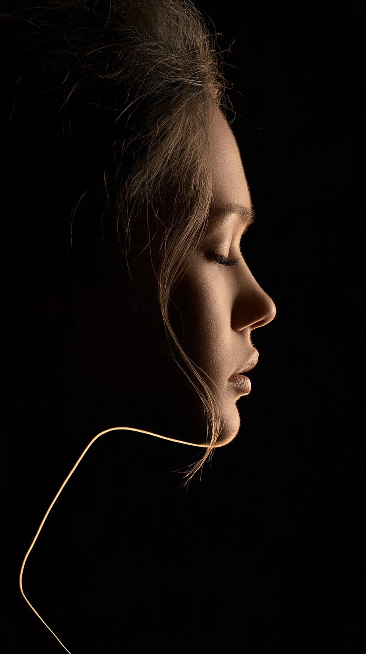 Editorial profile portrait with rim light
